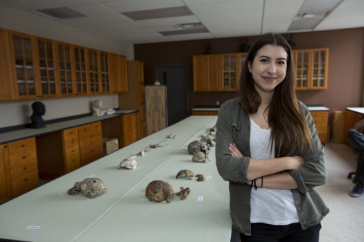 Undergraduate student Klara Komza with fossils in a laboratory